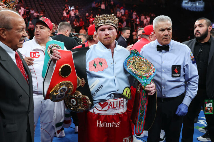 Saul "Canelo" Alvarez poses with his championship belts after his unanimous decision victory against Gennadiy "GGG" Golovkin, i...