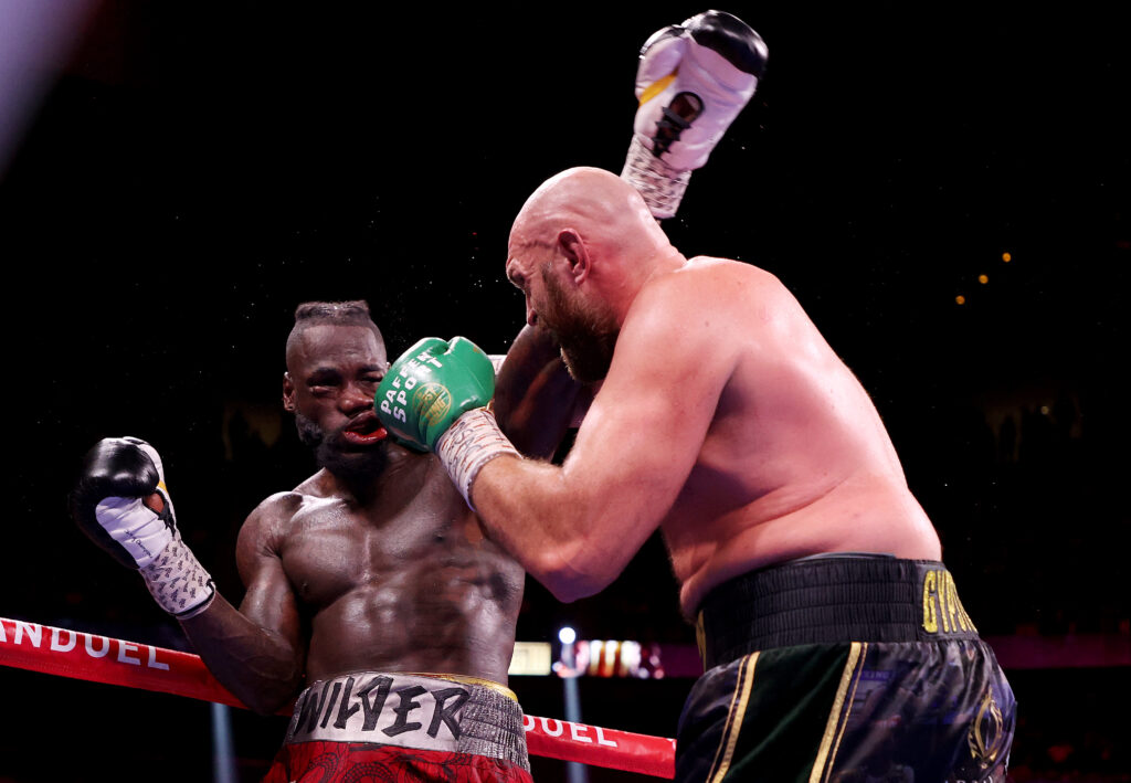 Deontay Wilder being punched by Tyson Fury in their third boxing match