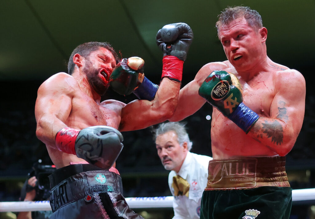 Canelo Alvarez lands a left hook on John Ryder
