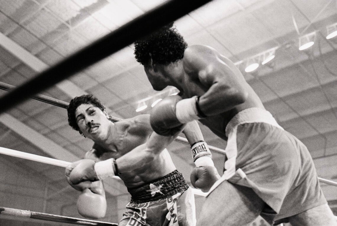 (Original Caption) 8/21/1981-Las Vegas, NV- Puffy-eyed Wilfredo Gomez (L) looks dazed after being hit by defending champion Salvador Sanchez for th...