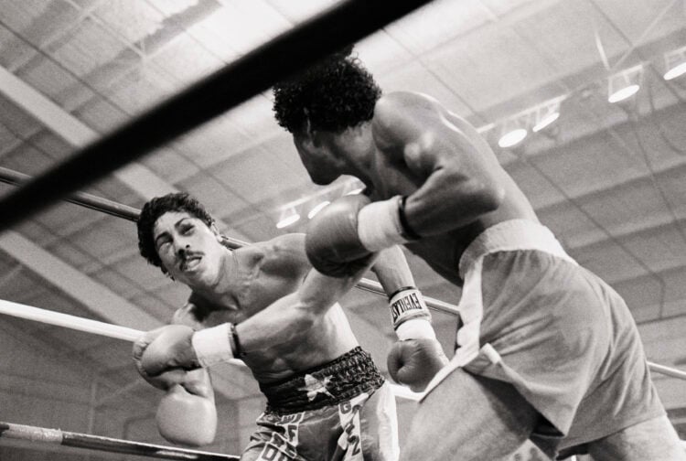 (Original Caption) 8/21/1981-Las Vegas, NV- Puffy-eyed Wilfredo Gomez (L) looks dazed after being hit by defending champion Salvador Sanchez for th...