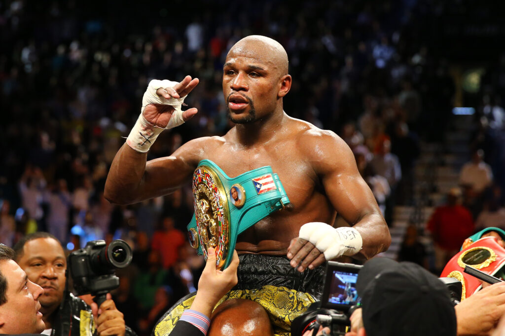 Floyd Mayweather Jr. celebrates defeating Robert Guerrero