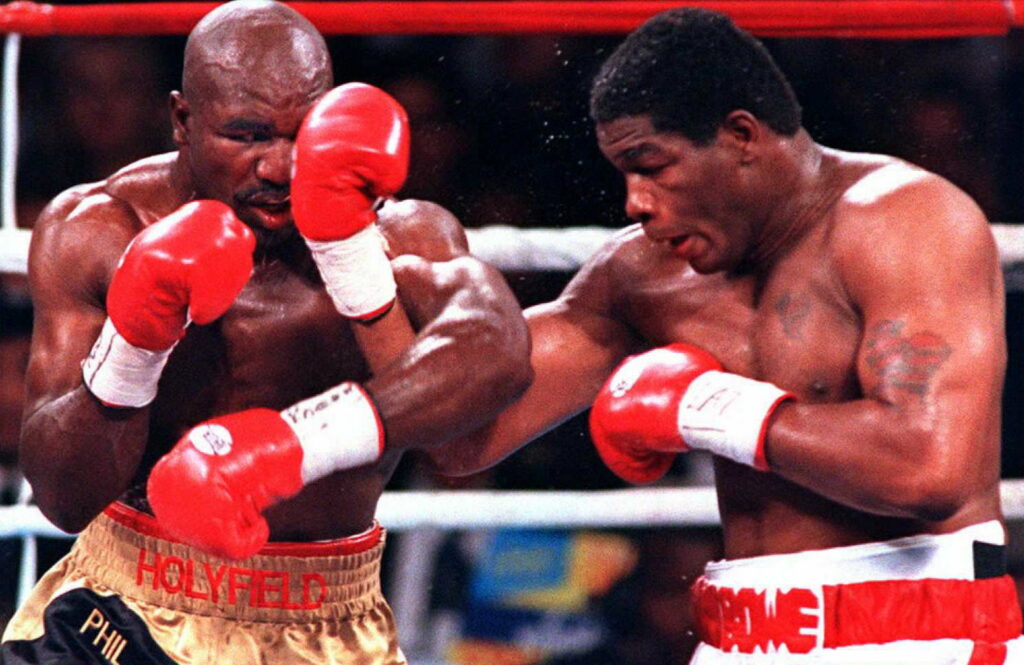 WBO Heavyweight Champion Riddick Bowe (R) deliever