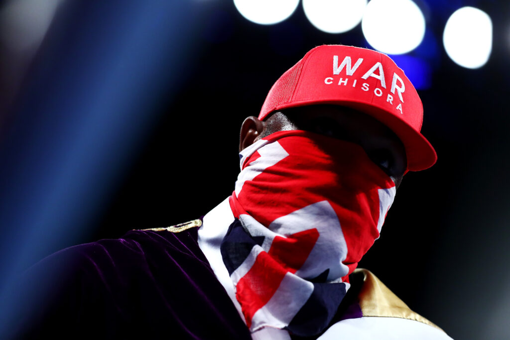 Derek Chisora with a bandana over his face