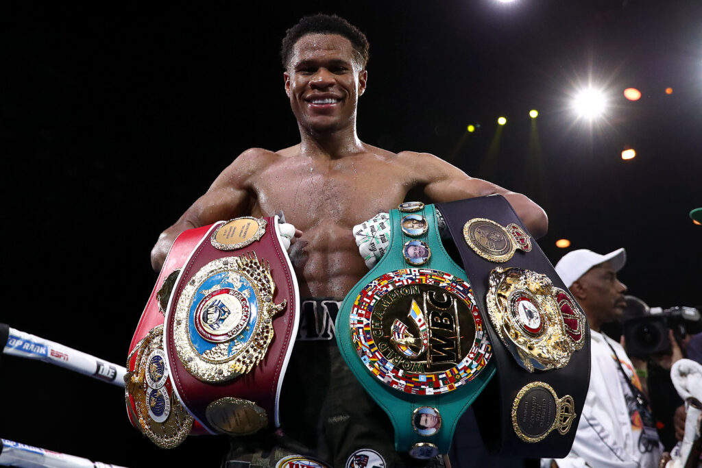 Devin Haney celebrates defeating George Kambosos