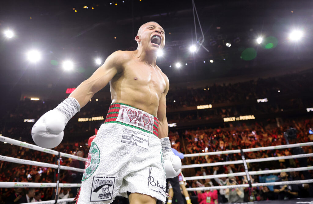 Isaac Cruz celebrates after beating Rolando Romero for a world title