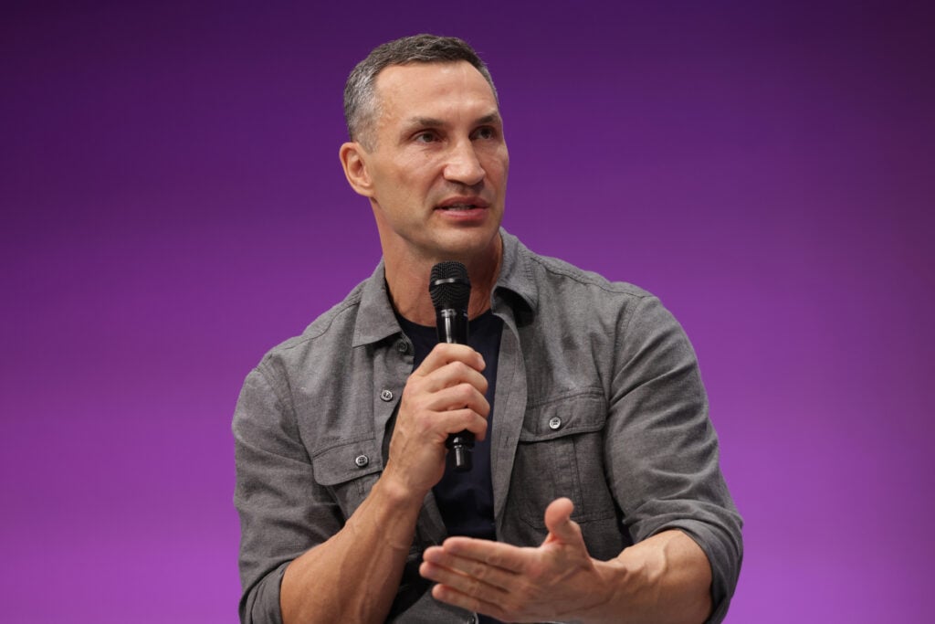 Wladimir Klitschko holding a microphone