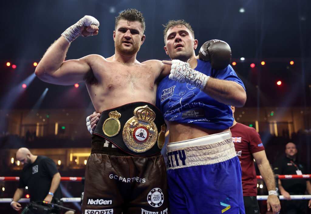 Johnny Fisher and Dave Allen embrace after their fight