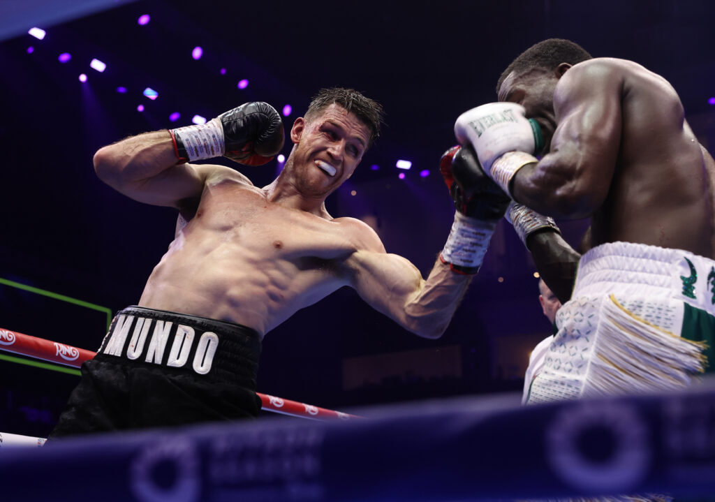 Callum Smith throwing an uppercut at Joshua Buatsi