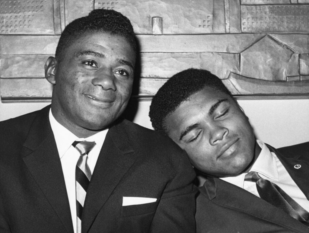 Cassius Clay Napping on Floyd Patterson's Shoulder