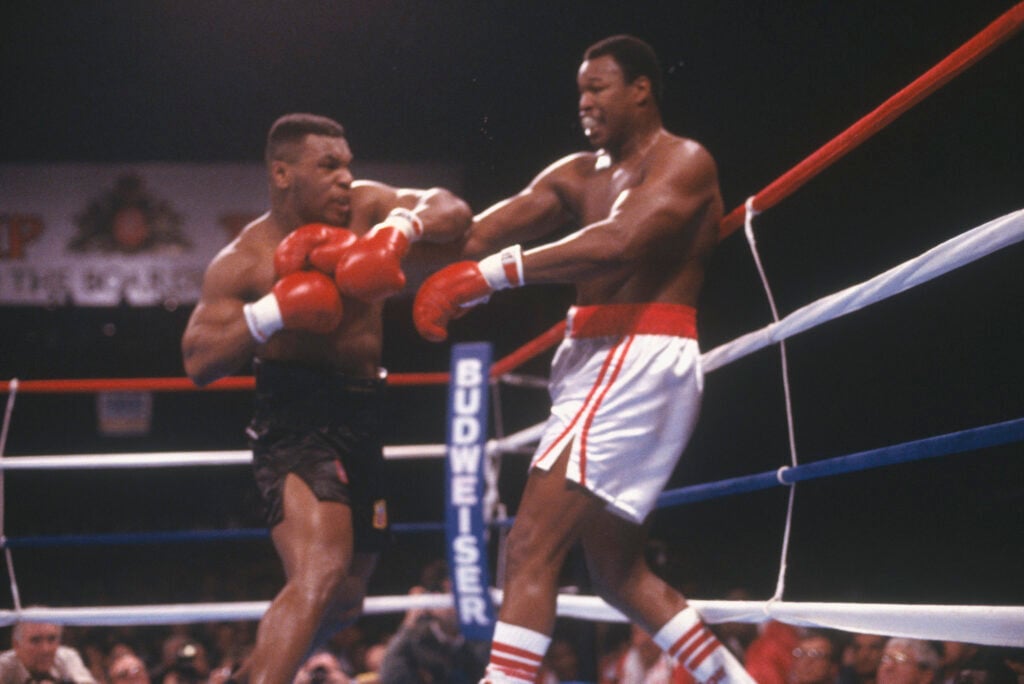 Mike Tyson punches Larry Holmes