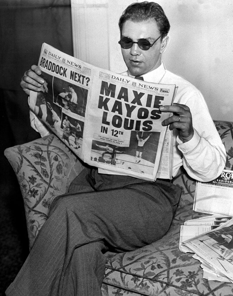 Max Schmeling reads New York Daily News account of his 12th