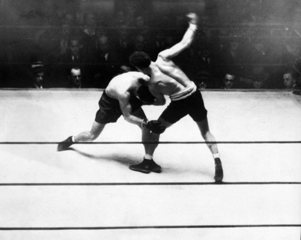 Maxie Rosenbloom sends a sweet left uppercut to Abie Bain in