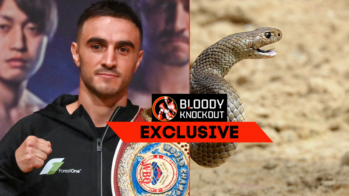 Jason Moloney and snake with exclusive banner