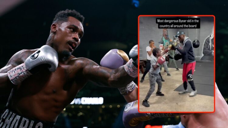 Saul "Canelo" Alvarez of Mexico (purple/gold trunks) trades punches with Jermell Charlo (black trunks) during their super middleweight title fight....