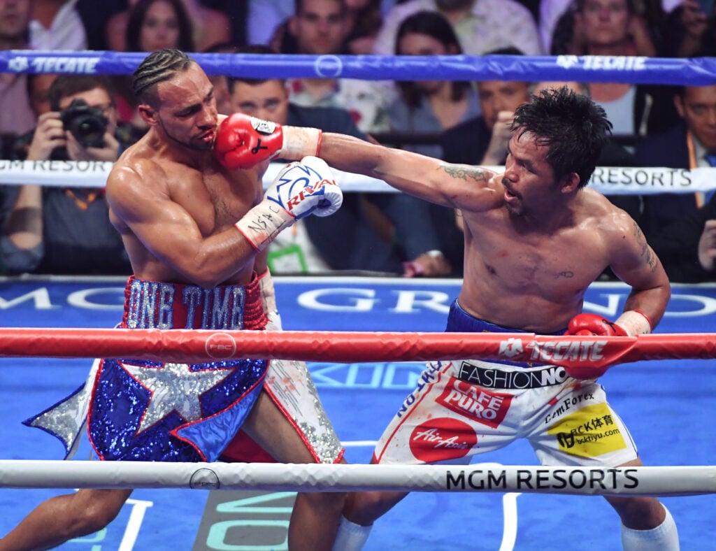 Manny Pacquiao landing punch on Keith Thurman