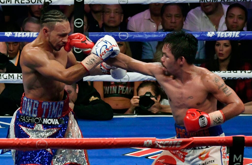 Manny Pacquiao landing a punch on Keith Thurman