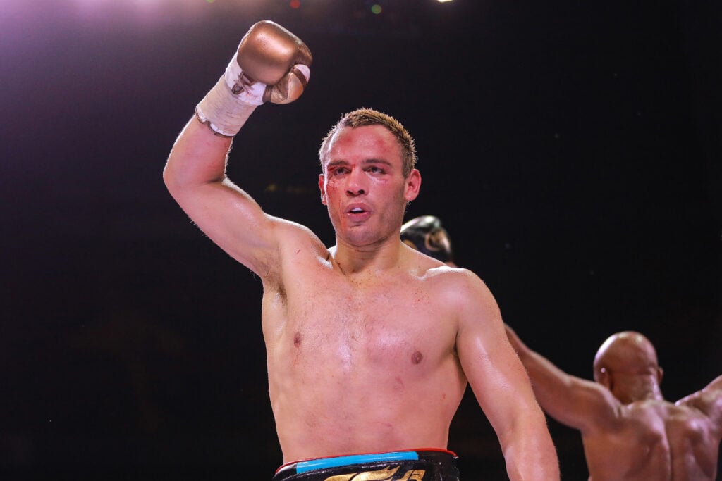 Julio Cesar Chavez lifts arm in celebration