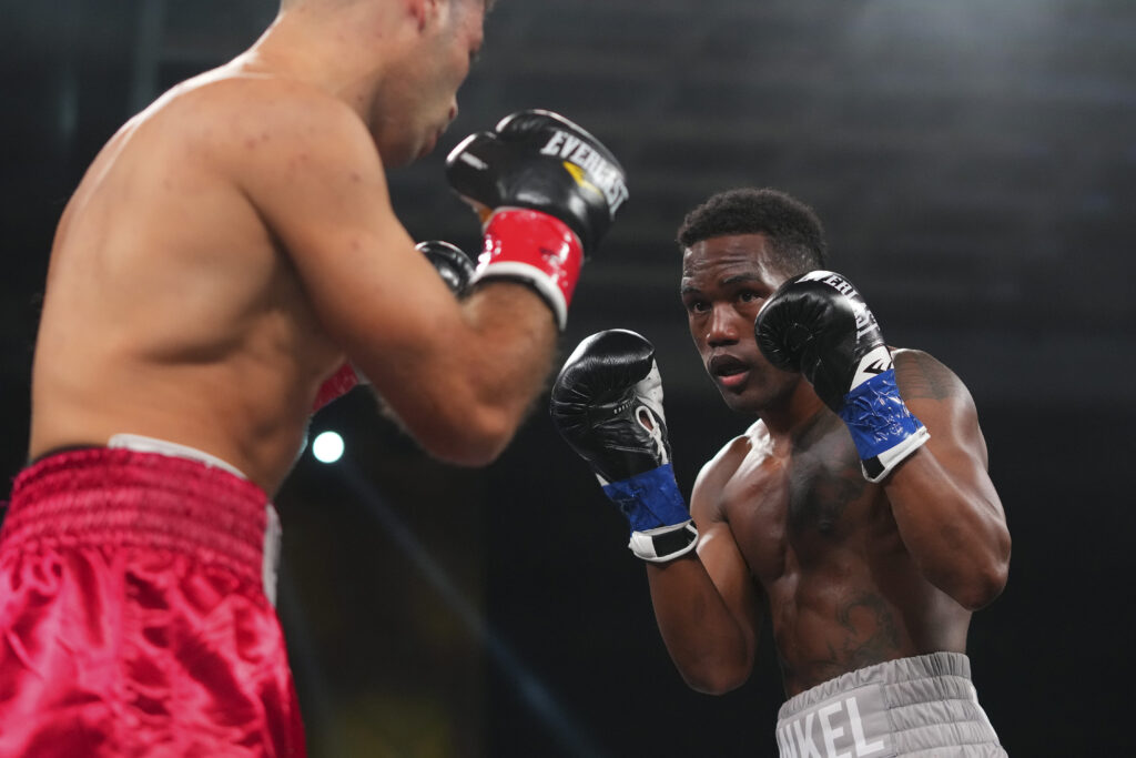 Subriel Matias faces Petros Ananyan with his hands high guarding his face