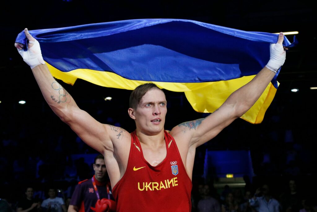 Oleksandr Usyk holding the Ukrainian flag