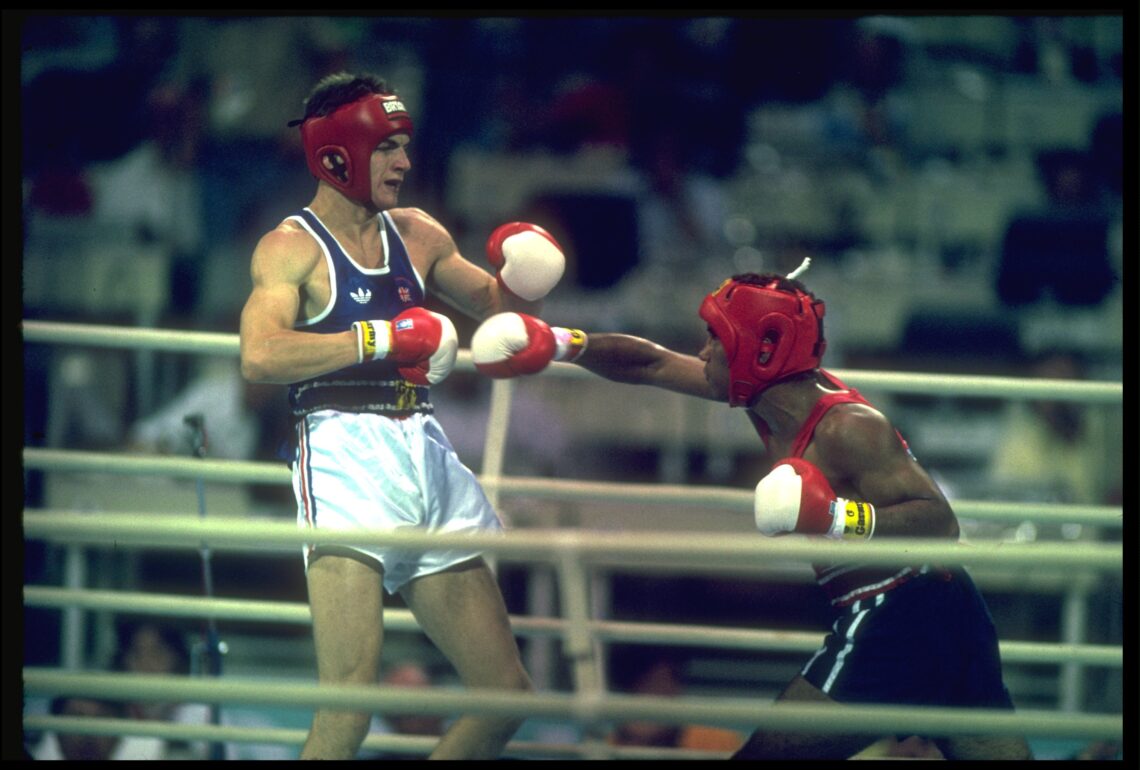 1 OCT 1988:  ROY JONES OF THE UNITED STATES THROWS A RIGHT HOOK AT RICHARD WOODHALL OF GREAT BRITAIN DURING THE SEMI FINALS OF THE JUNIOR MIDDLEWEI...