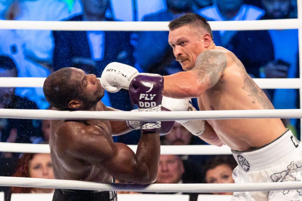 Oleksandr Usyk punches Daniel Dubois with a straight left hand