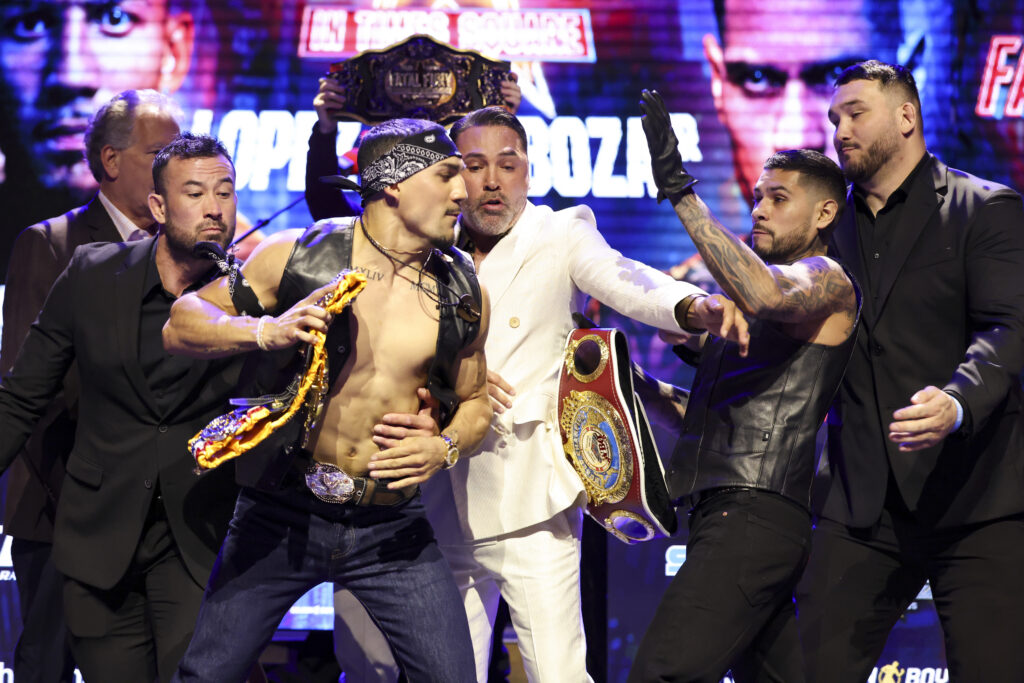 Teofimo Lopez and Arnold Barboza Jr. are separated during press conference faceoff in Los Angeles.