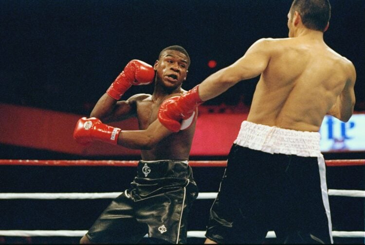 20 Nov 1997:  Floyd Mayweather (left) trades blows with Angelo Nunez during a fight at the Grand Olympic Auditorium in Los Angeles, California. Man...