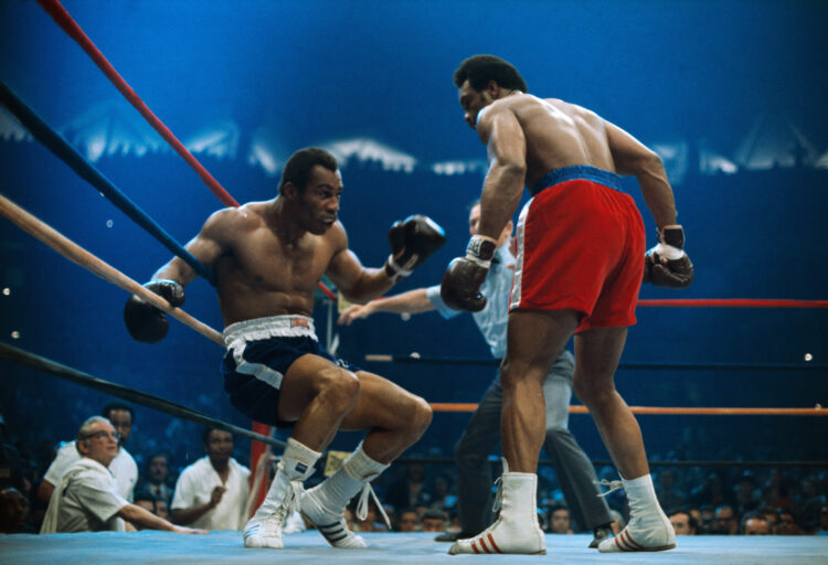 Ken Norton is groggy on the ropes after receiving a blow from heavyweight George Foreman.