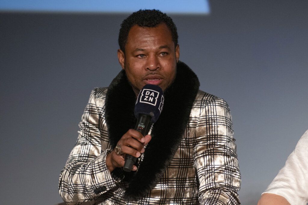 Shane Mosley speaking into microphone