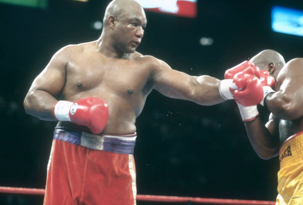 George Foreman punches Michael Moorer
