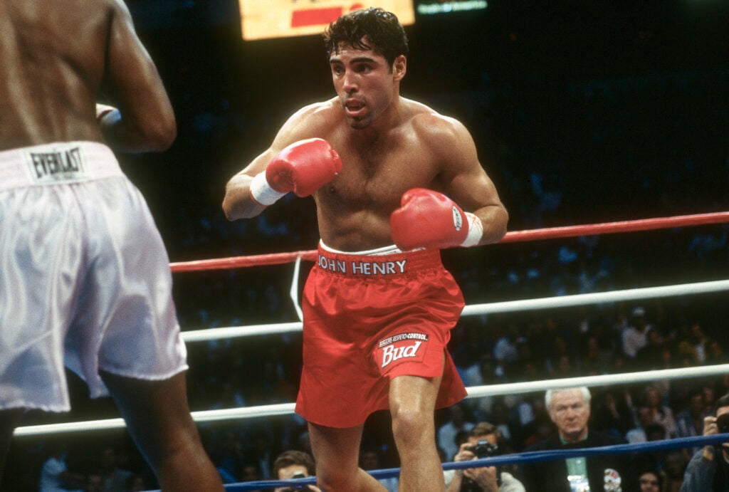 Oscar De La Hoya in ring preparing to throw a punch