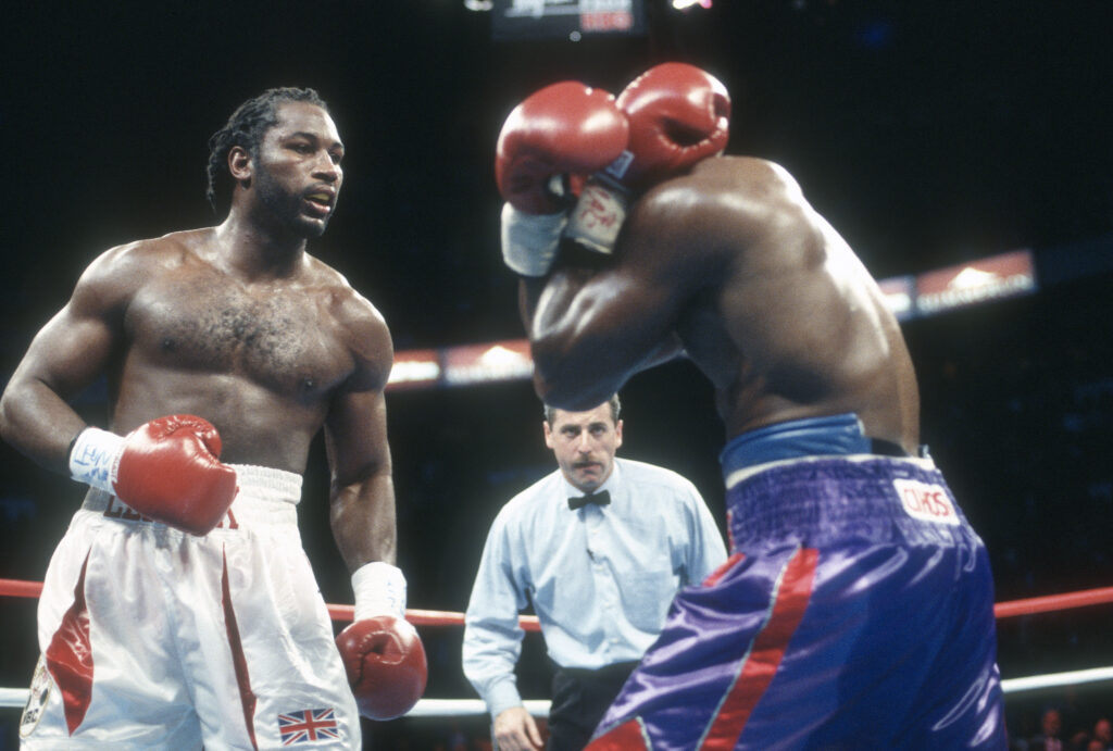 Lennox Lewis in ring with Evander Holyfield