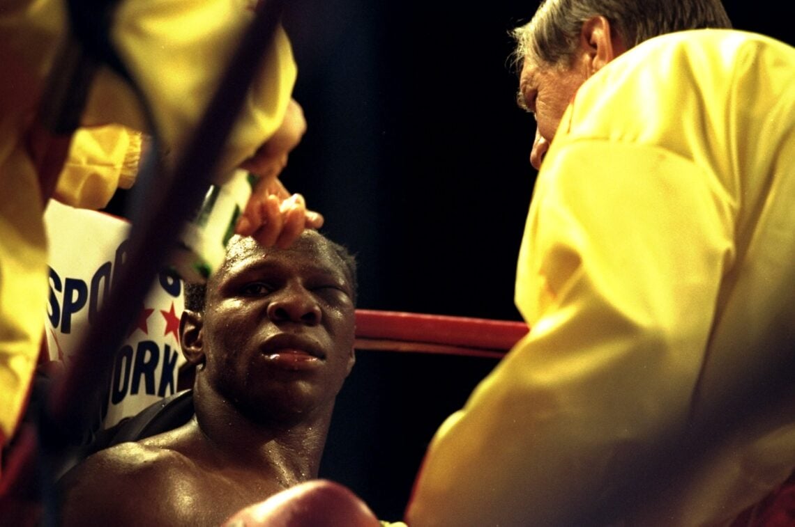 18 Jul 1998:  Chris Eubank of Great Britain receives treatment to his swollen left eye during the WBO Cruiserweight bout against Carl Thompson of G...