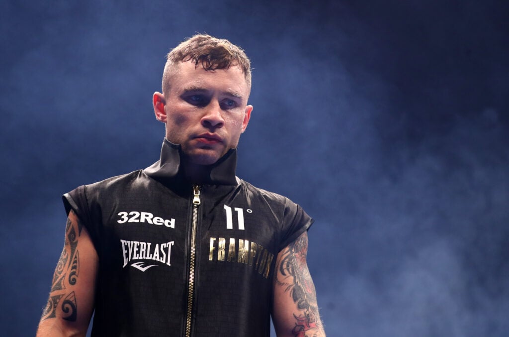 Carl Frampton in his ring attire with smoke surrounding him