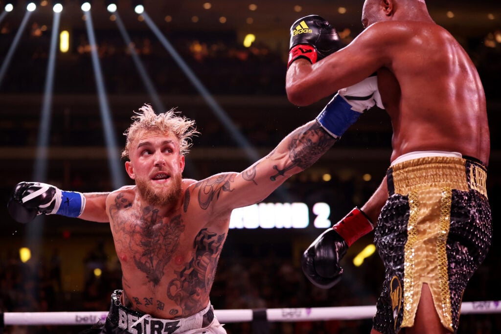Jake Paul throws a punch at Anderson Silva