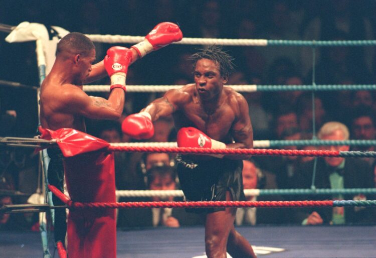 25 FEB  1995:  NIGEL BENN OF GREAT BRITAIN LAUNCHES A COUNTER ATTACK AGAINST GERALD MCCLELLAN OF THE USA ON HIS WAY TO KNOCKING HIM OUT IN THE TENT...