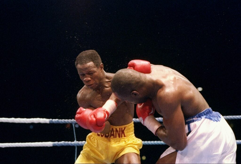 Chris Eubank and Nigel Benn trade shots