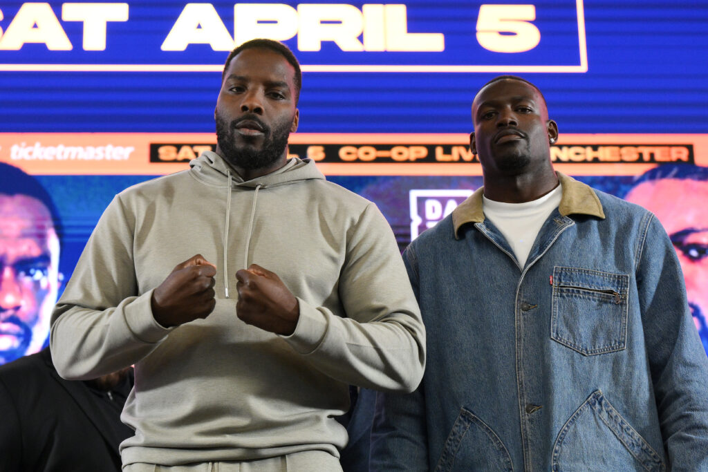 Lawrence Okolie stands beside Richard Riakporhe at press conference