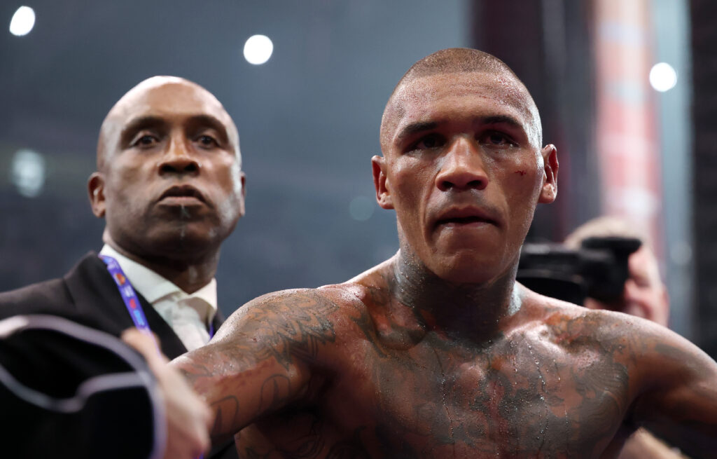 Nigel Benn standing alongside Conor Benn