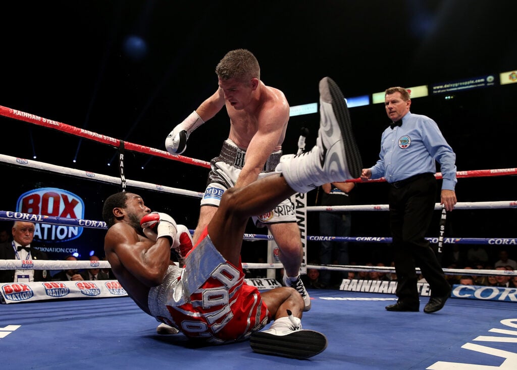 Liam Smith stands over John Thompson