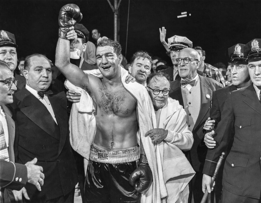 Rocky Marciano celebrates defeating Jersey Joe Walcott