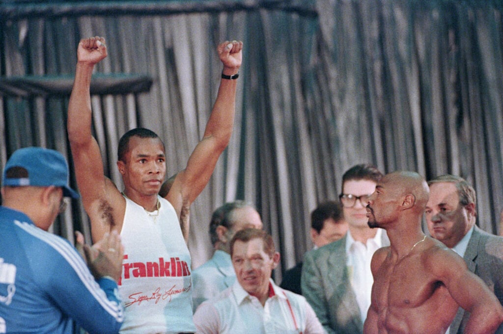 Sugar Ray Leonard Raising Arms On Scale
