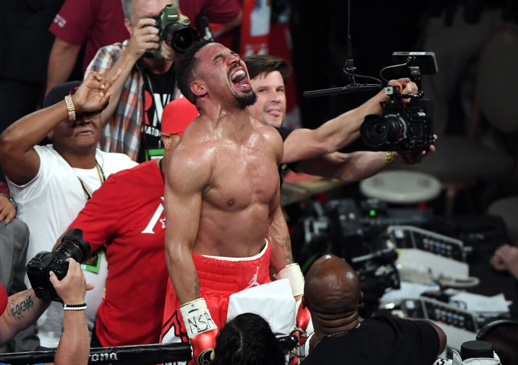 Andre Ward celebrates on ropes