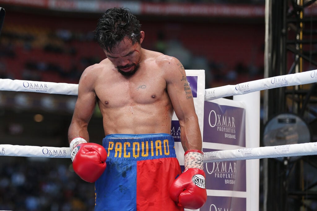 Manny Pacquiao hanging head in ring