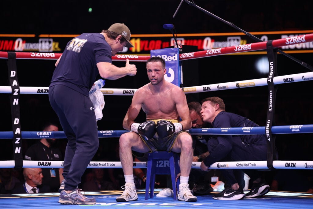 Josh Taylor on the stool between rounds looking forlorn