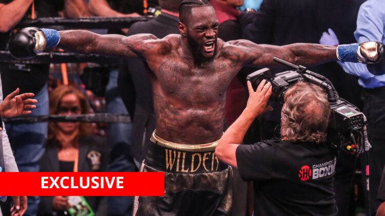 Deontay Wilder after defeating Dominic Breazeale with exclusive banner