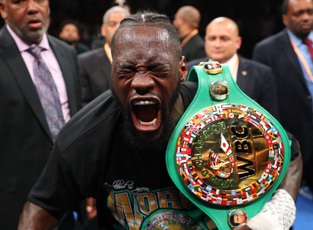 Deontay Wilder celebrates defeating Dominic Breazeale