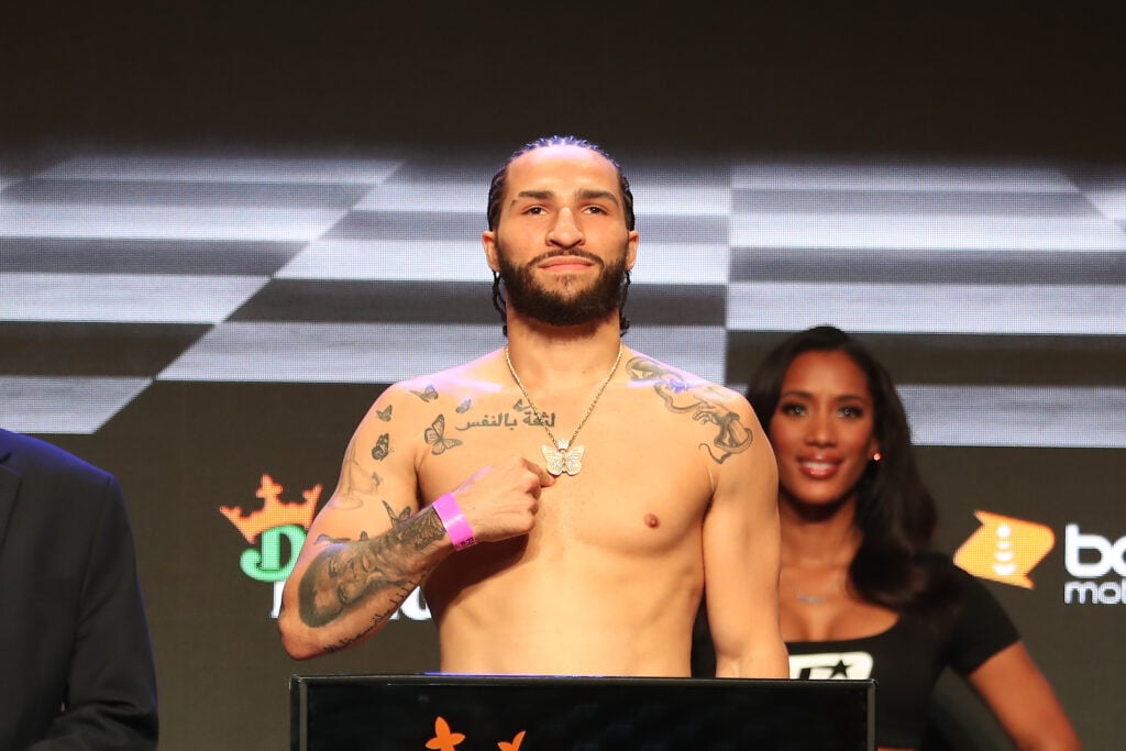 Nico Ali-Walsh poses on the scale during the ceremonial weigh-in ahead of his fight vs. Danny Rosenberger