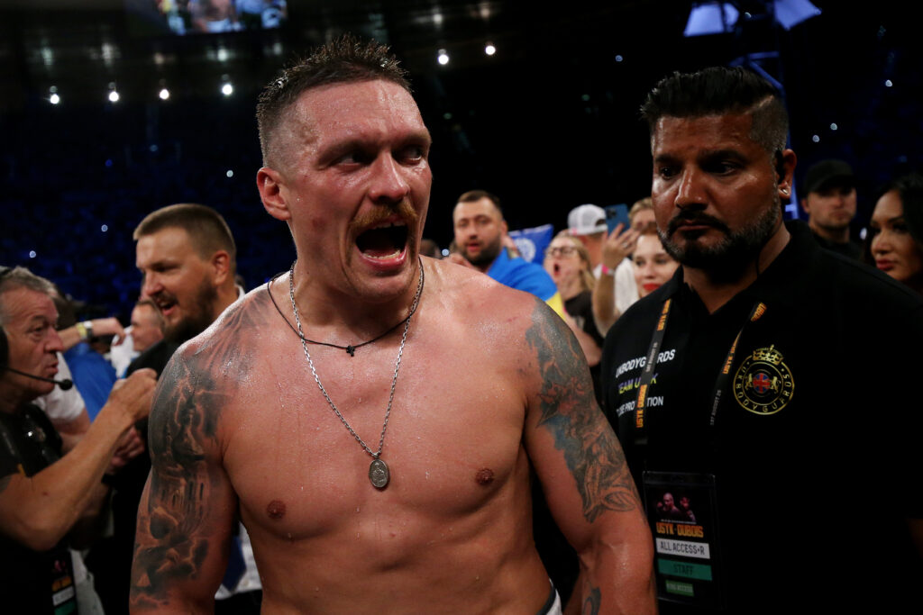Oleksandr Usyk celebrates defeating Daniel Dubois